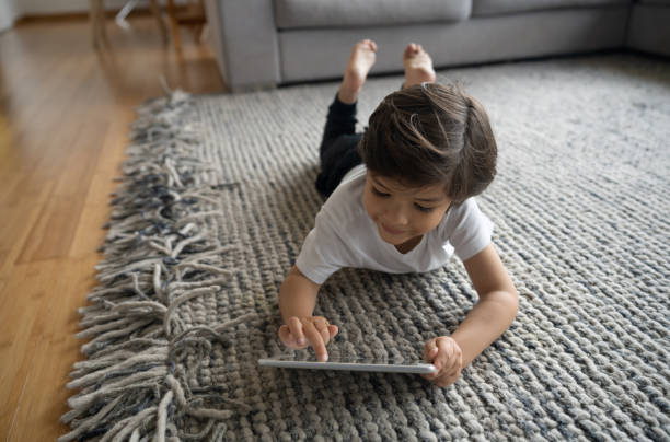 Girl laying on carpet floor | JCB Interiors
